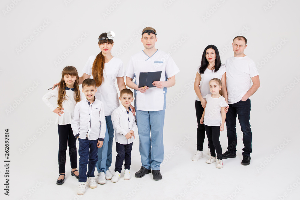 Consultation of an otolaryngologist. Doctors and patients - adults and children are isolated on a white background Consultation of an otolaryngologist. Doctors and patients - adults and children are isolated on a white background