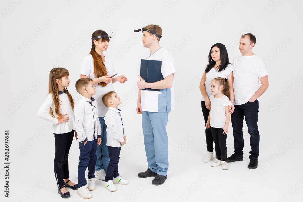 Consultation of an otolaryngologist. Doctors and patients - adults and children are isolated on a white background Consultation of an otolaryngologist. Doctors and patients - adults and children are isolated on a white background