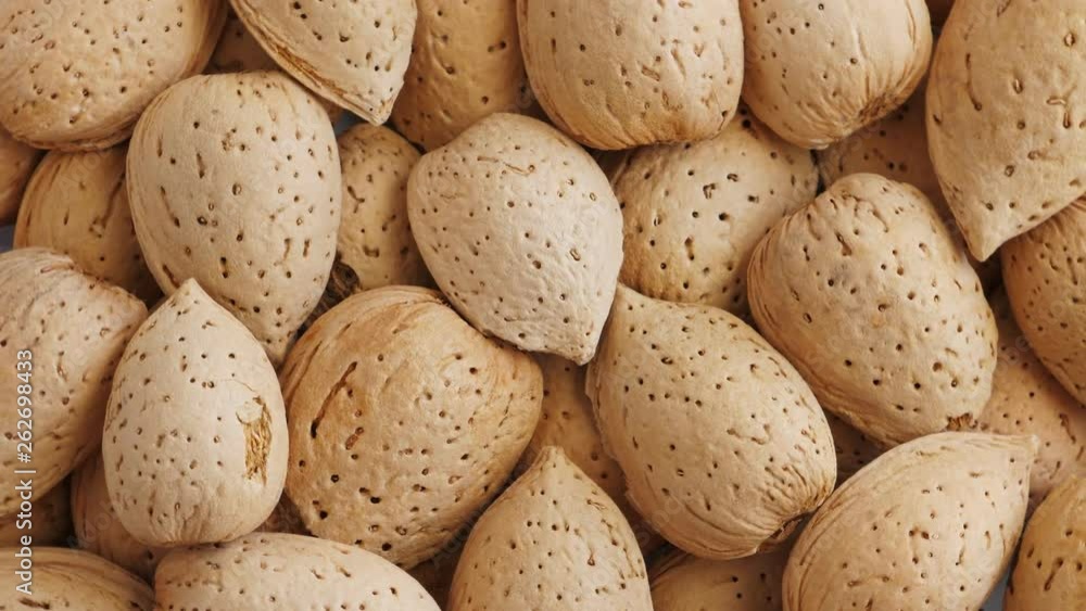 Almonds abstract background, top view. Rotate Almonds abstract background, top view. Rotate