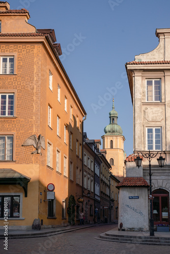 Street in Stare Miasto, Poland's capital Warshaw Old Town during sunrise. The tower of St. Martin's Church. photo