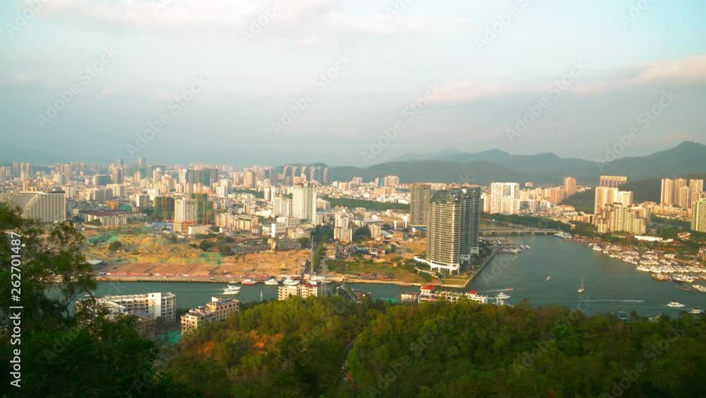 Stunning view of the beautiful and cozy city of Sanya, Hainan Island, China. Travel destination, adventure concept. Stunning view of the beautiful and cozy city of Sanya, Hainan Island, China. Travel destination, adventure concept.