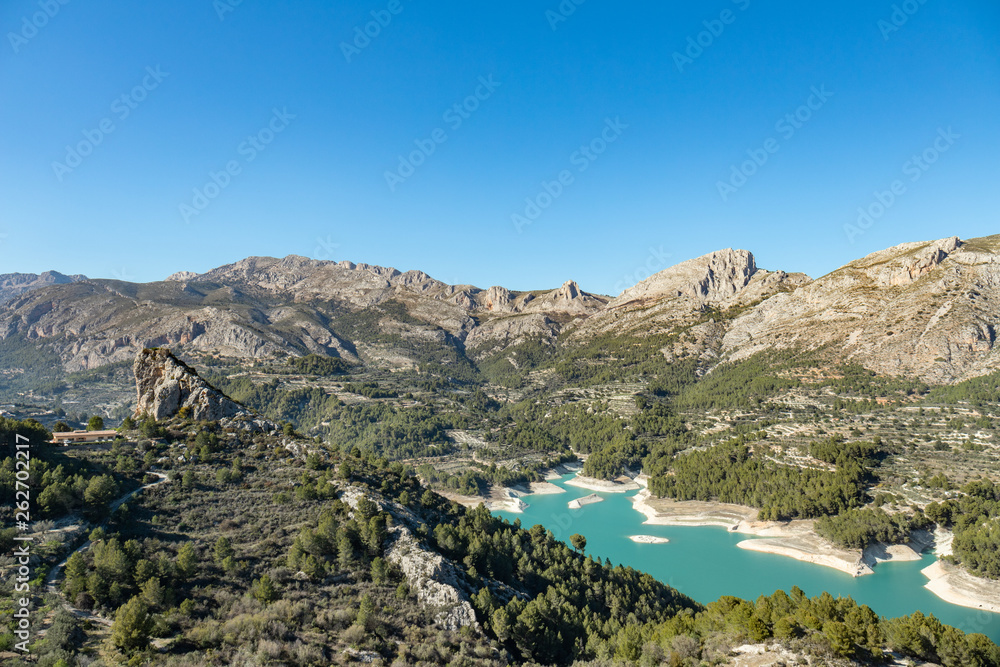 Wild nature with blue waters mountains and river near the castle of Guadalest in Alicante, Spain