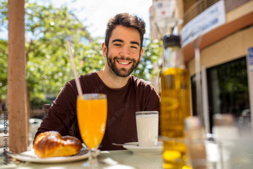 young man having a breakfast young man having a breakfast