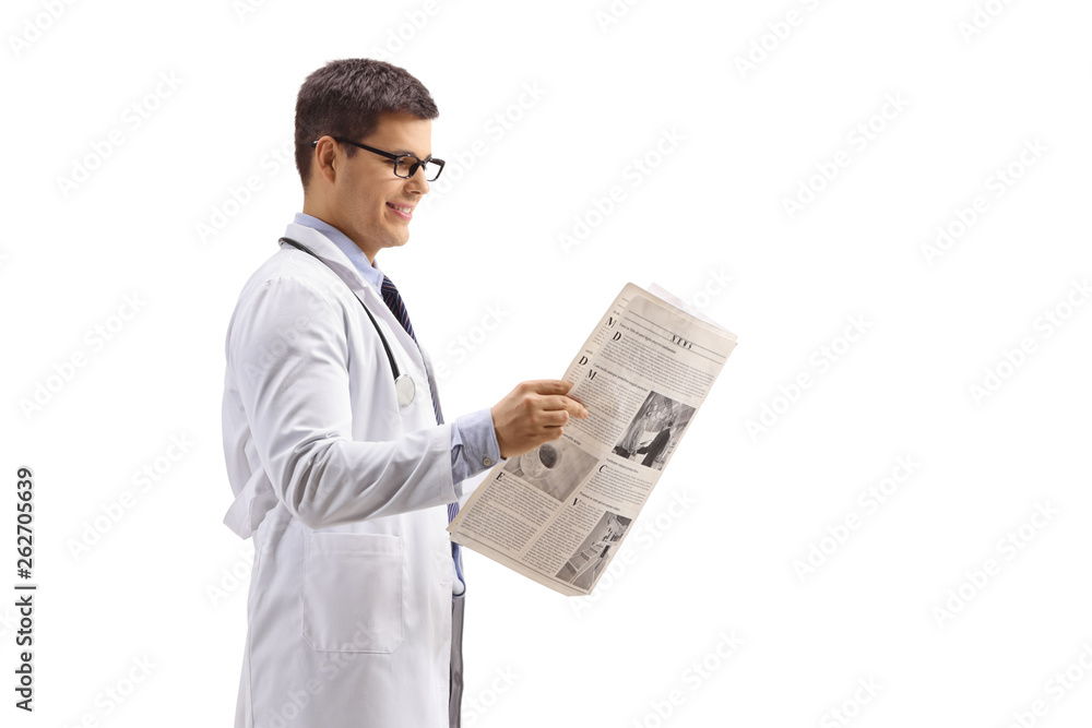 Young doctor standing and reading a newspaper Young doctor standing and reading a newspaper