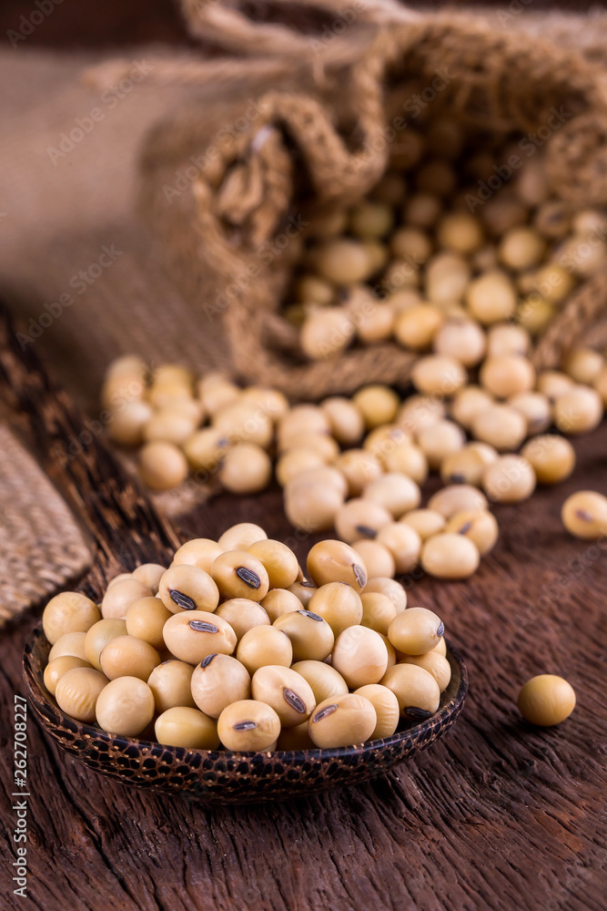 Soybean oil on a wooden background. rustic style Soybean oil on a wooden background. rustic style