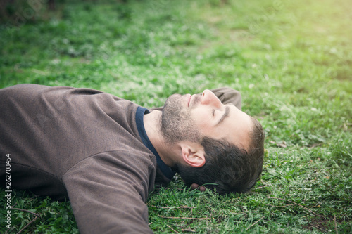 Caucasian man lying on grass. Relax © andranik123