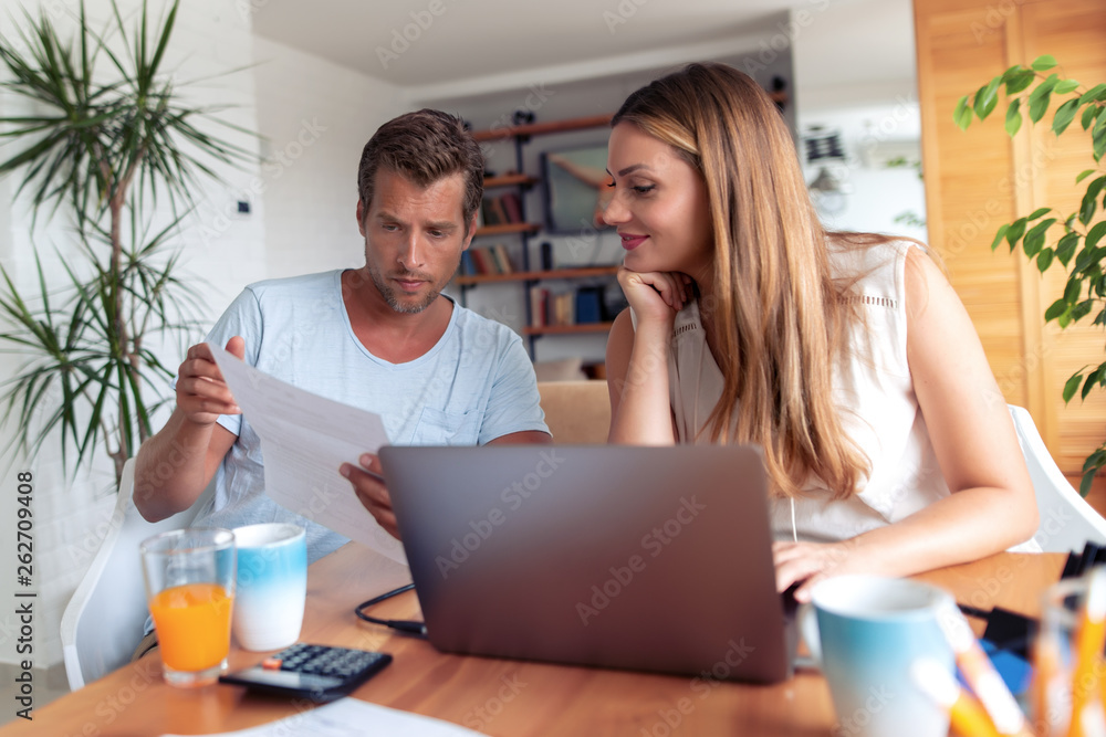 Couple paying online their bills Couple paying online their bills