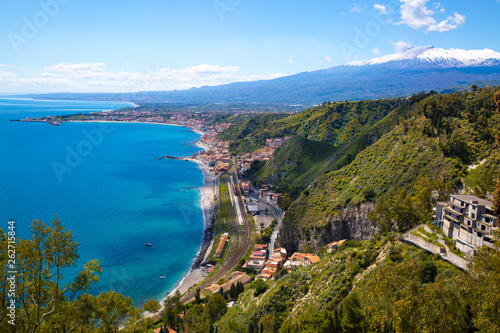 Scenic view of Etna volcano and blue Mediterranean sea (Ionian sea) from Taormina, Sicily island, Italy.