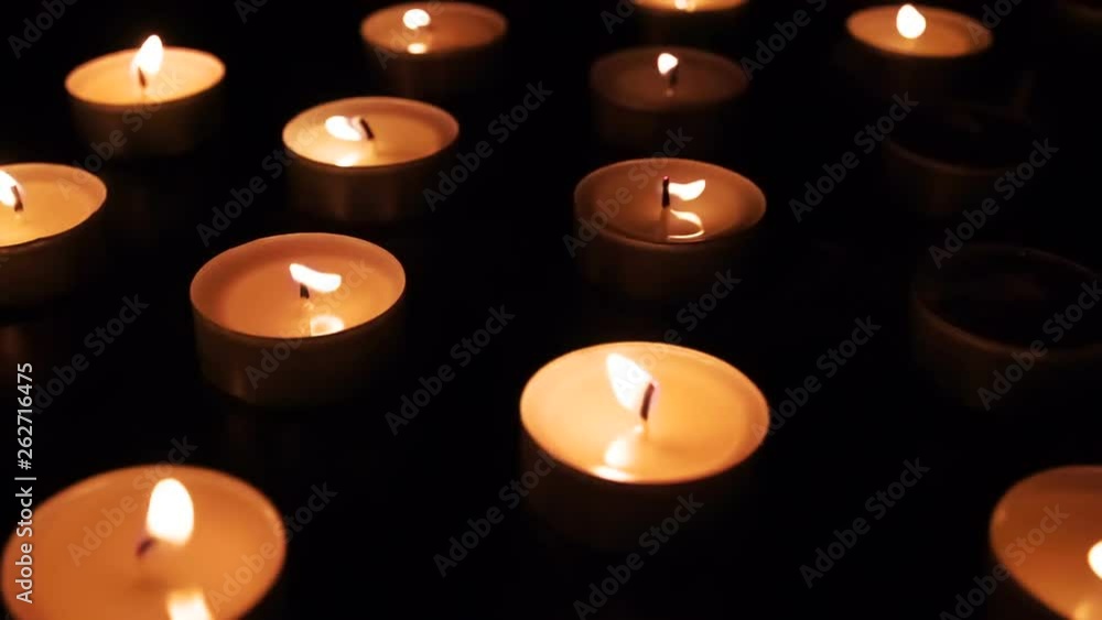 Candles Gradually Ignite Spontaneously. The flame of many candles trembles in the wind. Candles in turn ignite spontaneously Candles Gradually Ignite Spontaneously. The flame of many candles trembles in the wind. Candles in turn ignite spontaneously