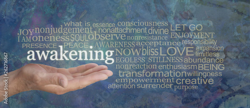 Spiritual Awakening Word Tag Cloud - male hand with the word AWAKENING floating above surrounded by a muted gold word cloud on a rustic blue background  photo