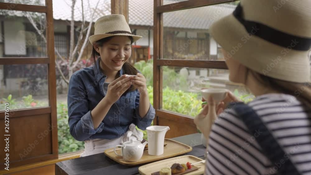 two asian girl friends tourist travel in kyoto japan in spring holidays experience japanese traditional culture in wooden house. young women holding tea bowl doing chado ceremony surprised face smell two asian girl friends tourist travel in kyoto japan in spring holidays experience japanese traditional culture in wooden house. young women holding tea bowl doing chado ceremony surprised face smell
