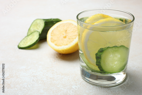 cup of water with lemon and cucumber