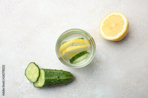 cup of  water with lemon and cucumber