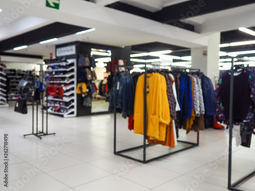 Abstract blurred photo of clothing store in a shopping mall, shopping concept