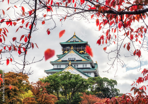 Architecture Osaka castle with red leaves falling in autumn park at Kyoto