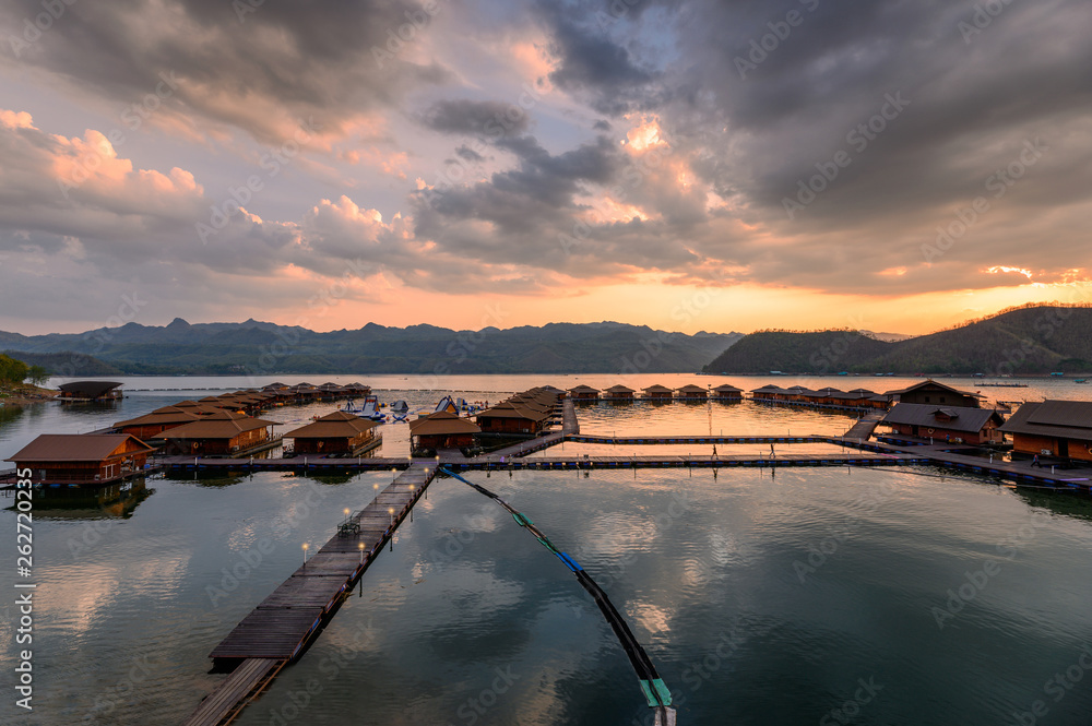 Scenery of wooden raft resort floating on Srinakarin dam in evening