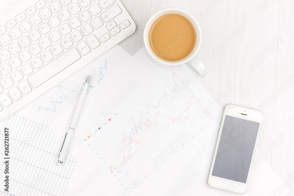 Flat lay photo of white office desk with laptop, smartphone, eyeglasses, notebook and pen with copy space background. Mockup Flat lay photo of white office desk with laptop, smartphone, eyeglasses, notebook and pen with copy space background. Mockup