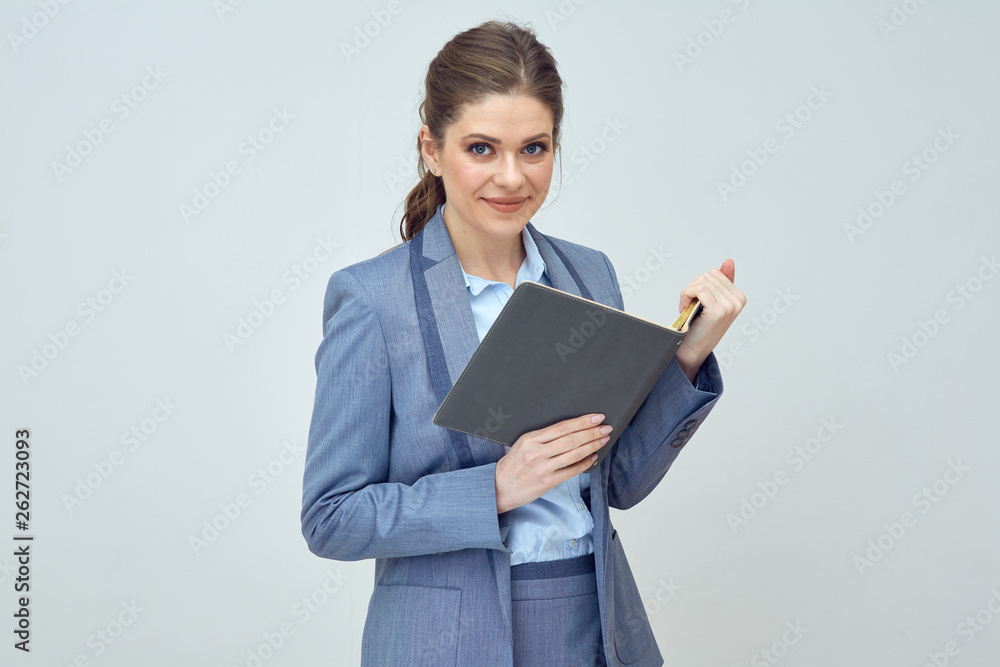 woman wearing office suit reading open book. woman wearing office suit reading open book.