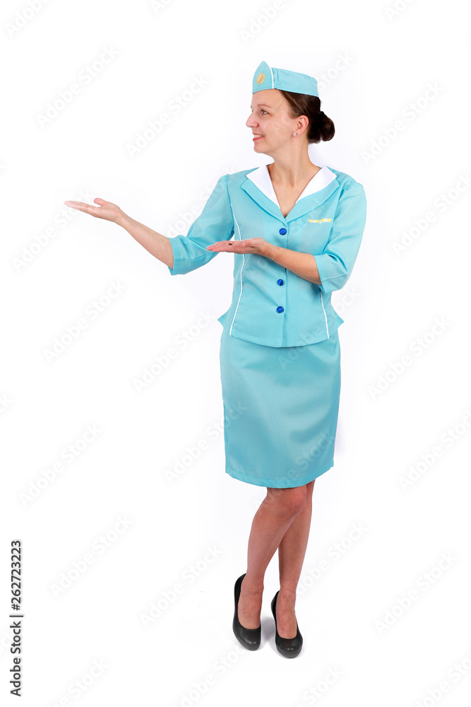 Stewardesse - Charming and smiling Stewardess Dressed In Blue Uniform Holding In Hand. Isolated on white background Stewardesse - Charming and smiling Stewardess Dressed In Blue Uniform Holding In Hand. Isolated on white background