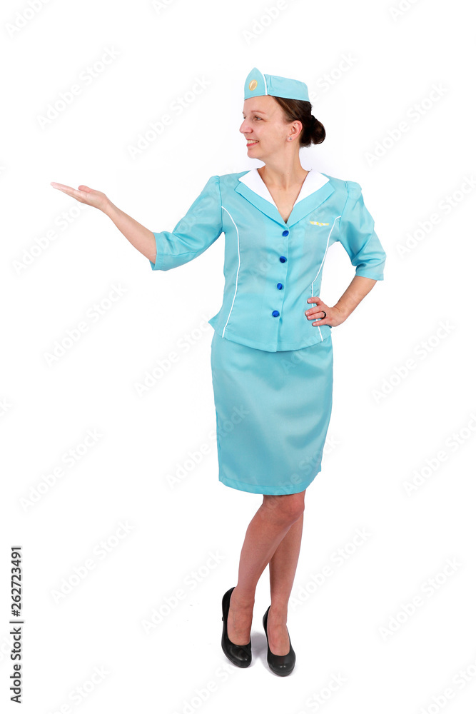 Stewardesse - Charming and smiling Stewardess Dressed In Blue Uniform Holding In Hand. Isolated on white background Stewardesse - Charming and smiling Stewardess Dressed In Blue Uniform Holding In Hand. Isolated on white background