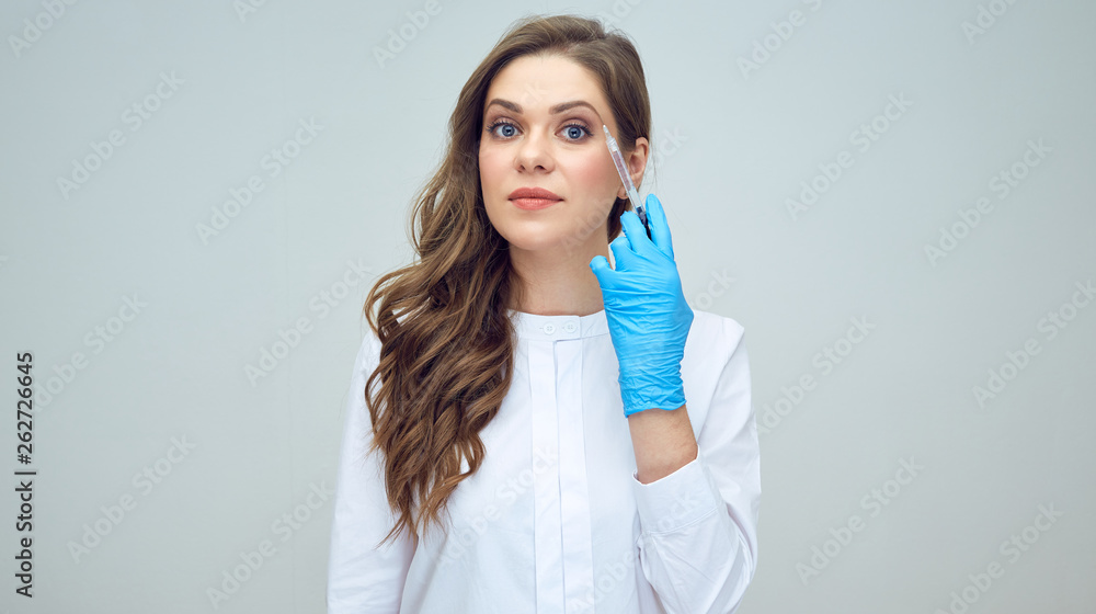 woman doctor holding syringe for hyaluronic acid injection. woman doctor holding syringe for hyaluronic acid injection.