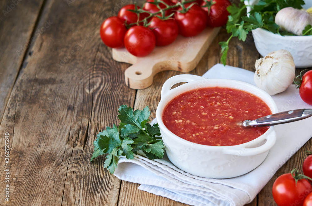 Spicy tomato sauce with garlic and horseradish in a white bowl Spicy tomato sauce with garlic and horseradish in a white bowl