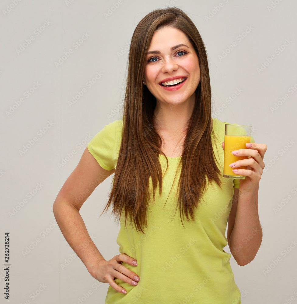 smiling woman holding glass with orange juice. smiling woman holding glass with orange juice.