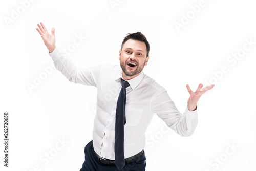 happy overweight man in tight formal wear looking at camera and gesturing with hands isolated on white