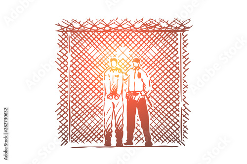 Prisoner and prison guard standing by wire fence, inmate in handcuffs, jail security, law enforcer in uniform