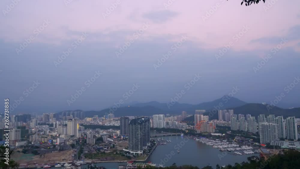 Sanya harbour during the sundown. Tropical holiday island of Hainan in the South China Sea. Sanya harbour during the sundown. Tropical holiday island of Hainan in the South China Sea.