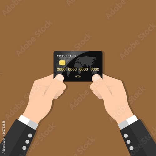 Hands holding credit card