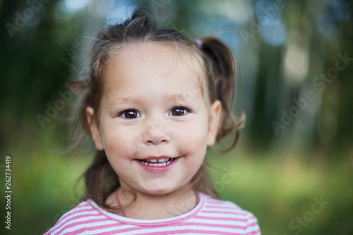 Lovely little girl outdoor portrait. Summertime, lifestyle