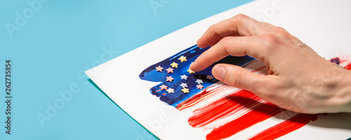 Celebration of independence day of America, woman hand painting american flag