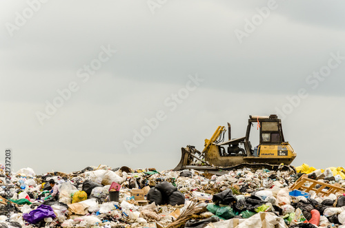 CHONBURI PROVINCE, THAILAND-JULY 14: People working in Municipal waste disposal open dump process. Dump site at Chonburi Province on JULY 14 , 2016 in CHONBURI PROVINCE THAILAND