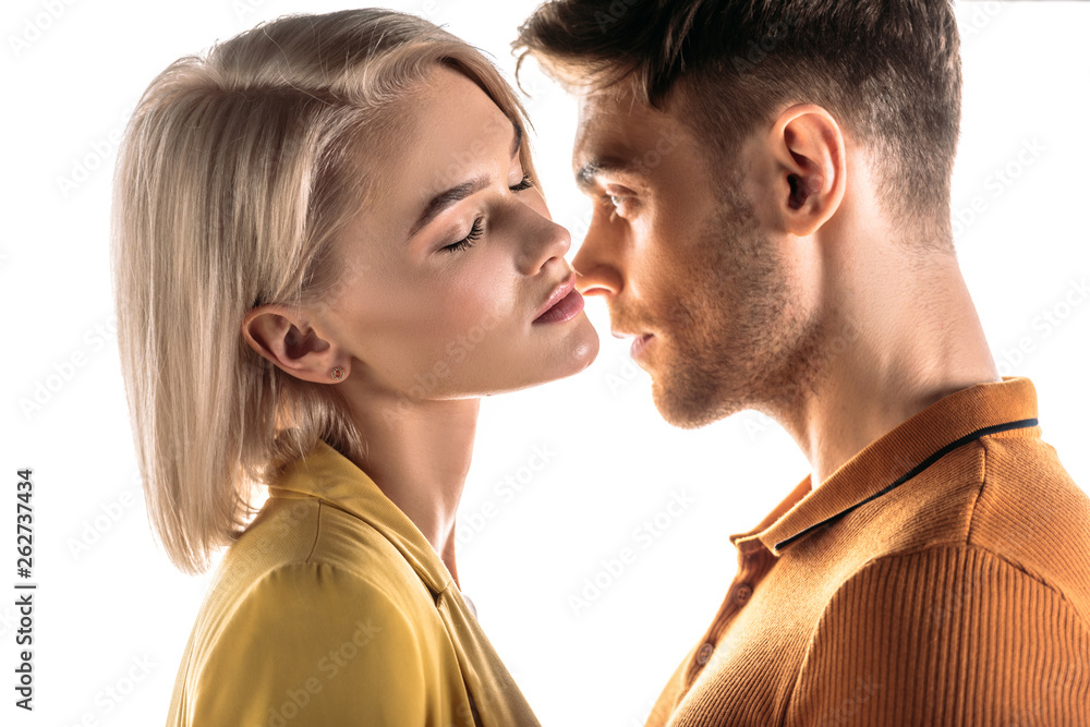 pretty woman with closed eyes and handsome man standing face to face isolated on white pretty woman with closed eyes and handsome man standing face to face isolated on white