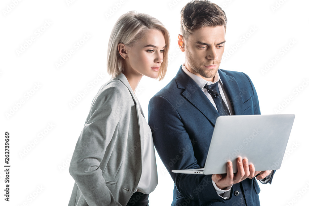 young, confident business partners using laptop isolated on white young, confident business partners using laptop isolated on white