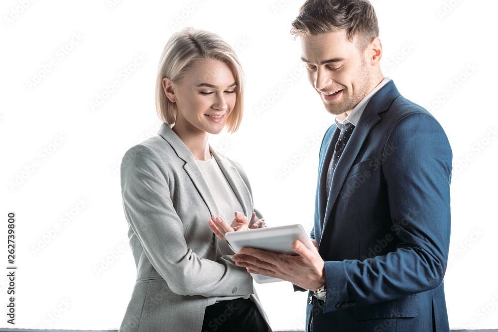 smiling young business partners using digital tablet isolated in white smiling young business partners using digital tablet isolated in white