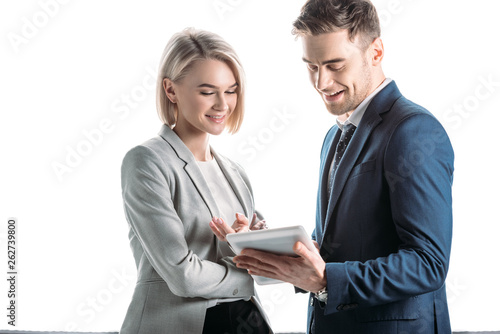 smiling young business partners using digital tablet isolated in white