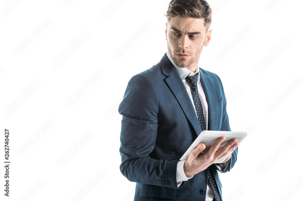 serious, thoughtful businessman using digital tablet isolated on white serious, thoughtful businessman using digital tablet isolated on white