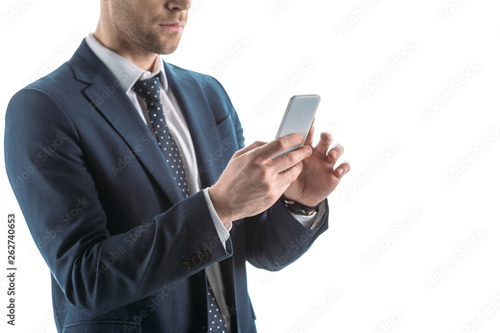 partial view of businessman in suite using smartphone isolated on white partial view of businessman in suite using smartphone isolated on white