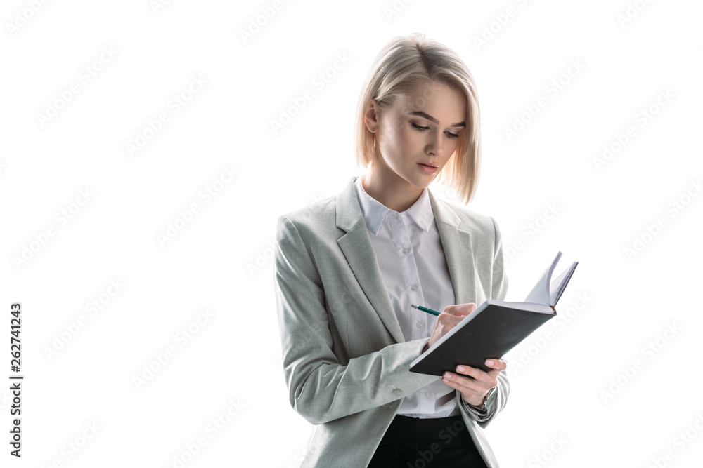 beautiful, attentive businesswoman writing in notebook isolated on white beautiful, attentive businesswoman writing in notebook isolated on white