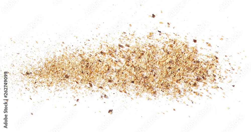 Ground, milled nutmeg powder isolated on white background, top view