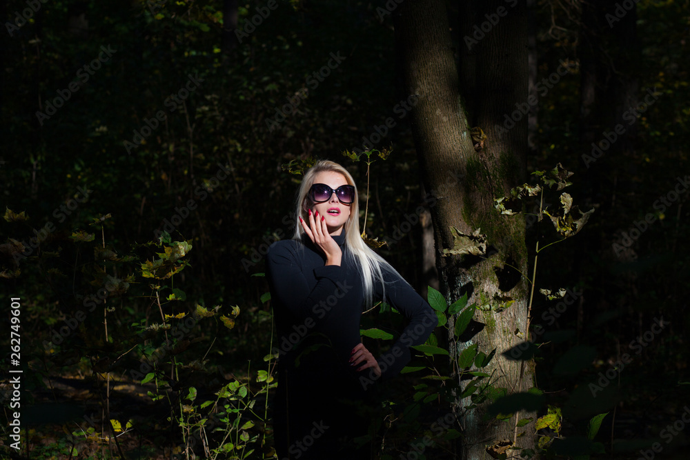 Happy young fashion woman in autumn forest Happy young fashion woman in autumn forest