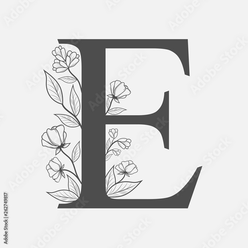 Uppercase Letter E with flowers and branches. Vector flowered monogram or logo. Hand Drawn concept. Botanical design branding. Composition of letter and flowers for wedding card, invitations, brand