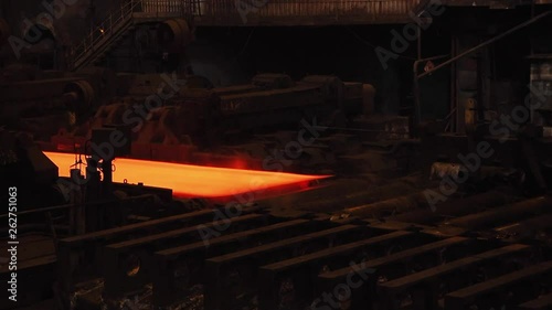 Steel plant, production of steel sheets, transportation of hot sheets on the production line, heavy industry, metal rolling plant. Conveyor line metal rolling mill.
