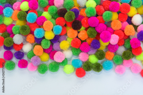 A colorful  Pom Pom background with white space