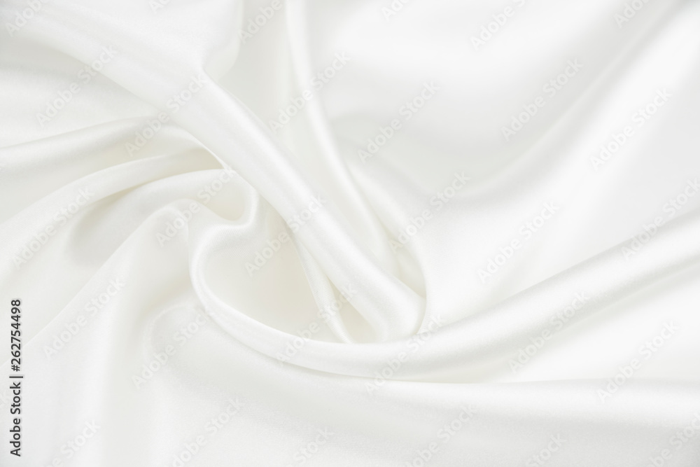 The texture of the satin fabric of white color for the background The texture of the satin fabric of white color for the background