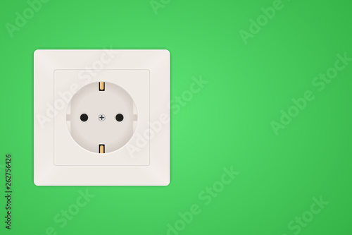 Power socket. European Type F socket on green wall background