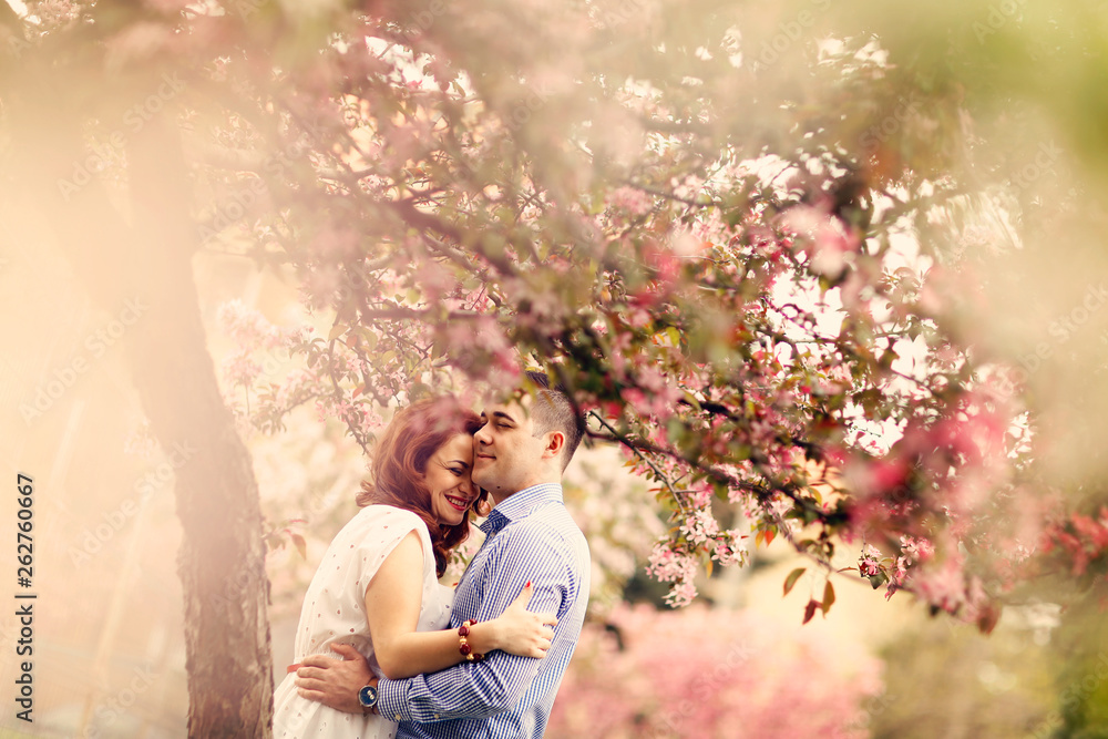 Beautiful couple posing in park Beautiful couple posing in park