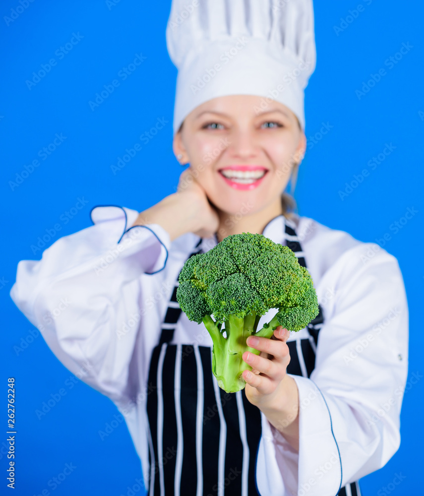 Loaded with vitamin. Lady cook smiling with vitamin broccoli. Happy woman holding fresh green vitamin broccoli crop. Professional chef with vitamin broccoli cabbage Loaded with vitamin. Lady cook smiling with vitamin broccoli. Happy woman holding fresh green vitamin broccoli crop. Professional chef with vitamin broccoli cabbage